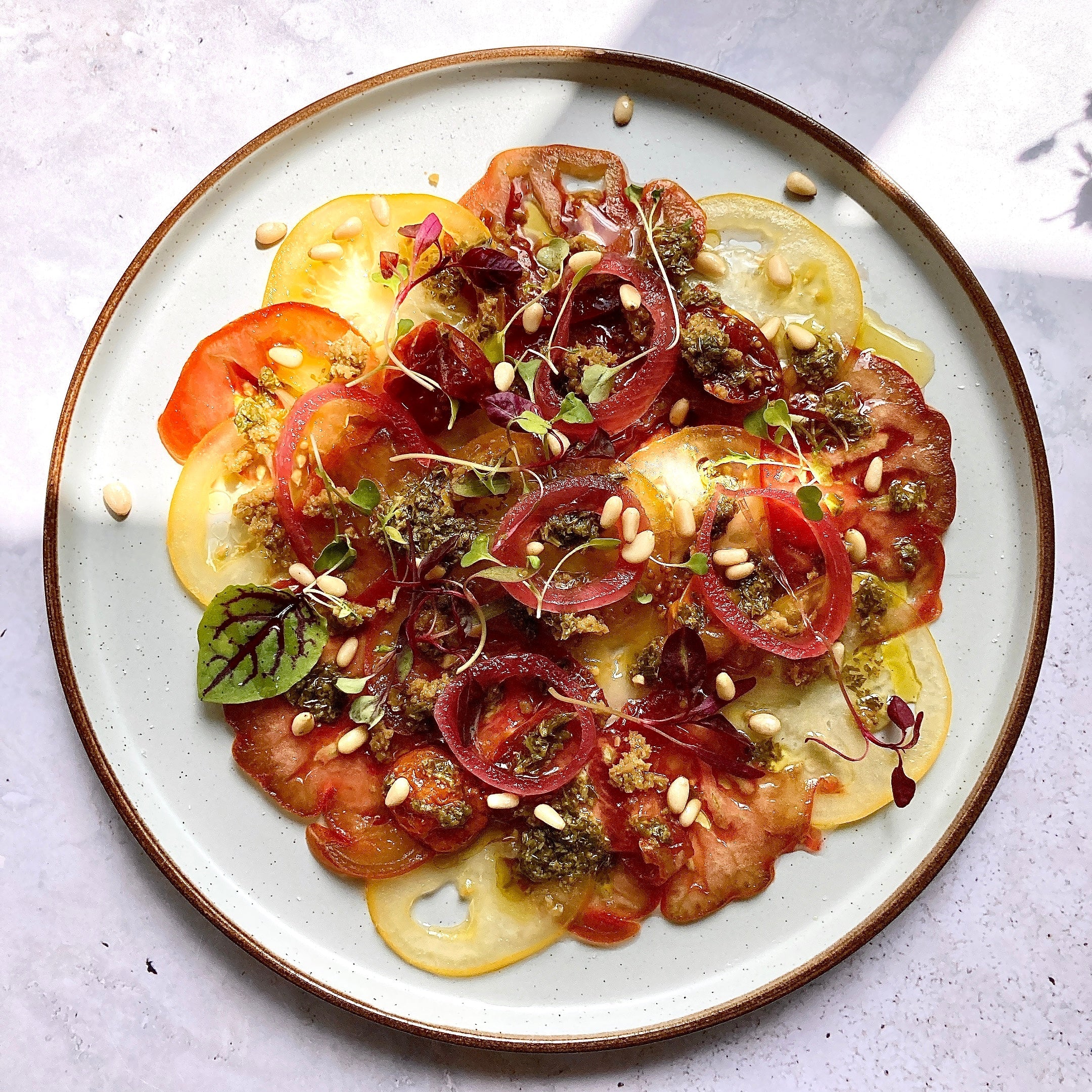 Beef tomato carpaccio with green olives tapenade