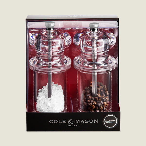 #salt&pepperset
A boxed set of two Cole & Mason 505 Salt & Pepper Mills, featuring adjustable settings and durable grinders, filled with coarse salt and whole black peppercorns, shown in retail packaging against a light background.