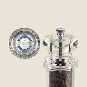#pepper
A clear acrylic Cole & Mason 505 Pepper Mill filled with black peppercorns is shown from the side and top, featuring adjustable settings and Cole & Mason England branding on the metal grinder—part of their Salt & Pepper Mills collection.