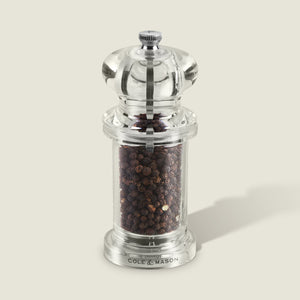 #pepper
A clear acrylic 505 Pepper Mill by Cole & Mason, featuring adjustable settings, whole black peppercorns, a silver top knob, and Cole & Mason label at the base—ideal for Salt & Pepper Mills collections, photographed on a light gray background.