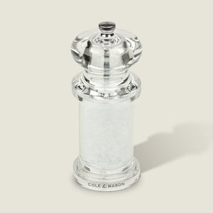 #salt
The Cole & Mason 505 Salt & Pepper Mill stands upright on a light gray background. This clear acrylic grinder features adjustable settings for customizable seasoning.