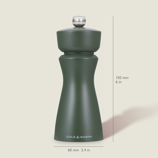 A dark green Kenton Rosemary Salt & Pepper Mill by Cole & Mason, with a ceramic mechanism and interchangeable knobs, stands upright at 150 mm tall and 60 mm wide on a light background.
