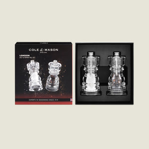 The Cole & Mason London Acrylic Salt & Pepper Mills boxed set features high-performance grinders in clear acrylic, packaged side by side in sleek black packaging—an elegant addition to any modern kitchen.