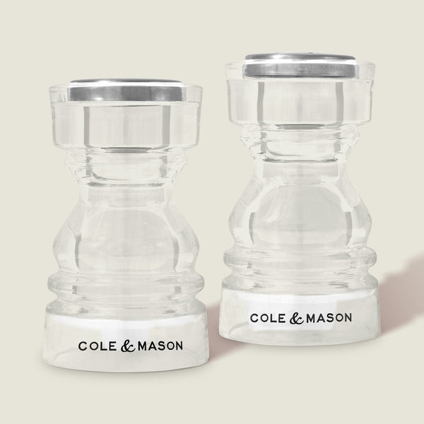 #86mm 
Two clear Cole & Mason London Acrylic Salt & Pepper Shakers with silver tops and black branding on their bases, displayed side by side against a light background.