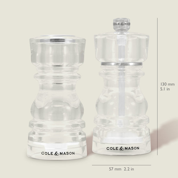 The Cole & Mason London Acrylic Salt Shaker & Pepper Mill Set includes clear, 130mm tall grinders, each 57mm wide—sleek and ideal for modern tableware settings.