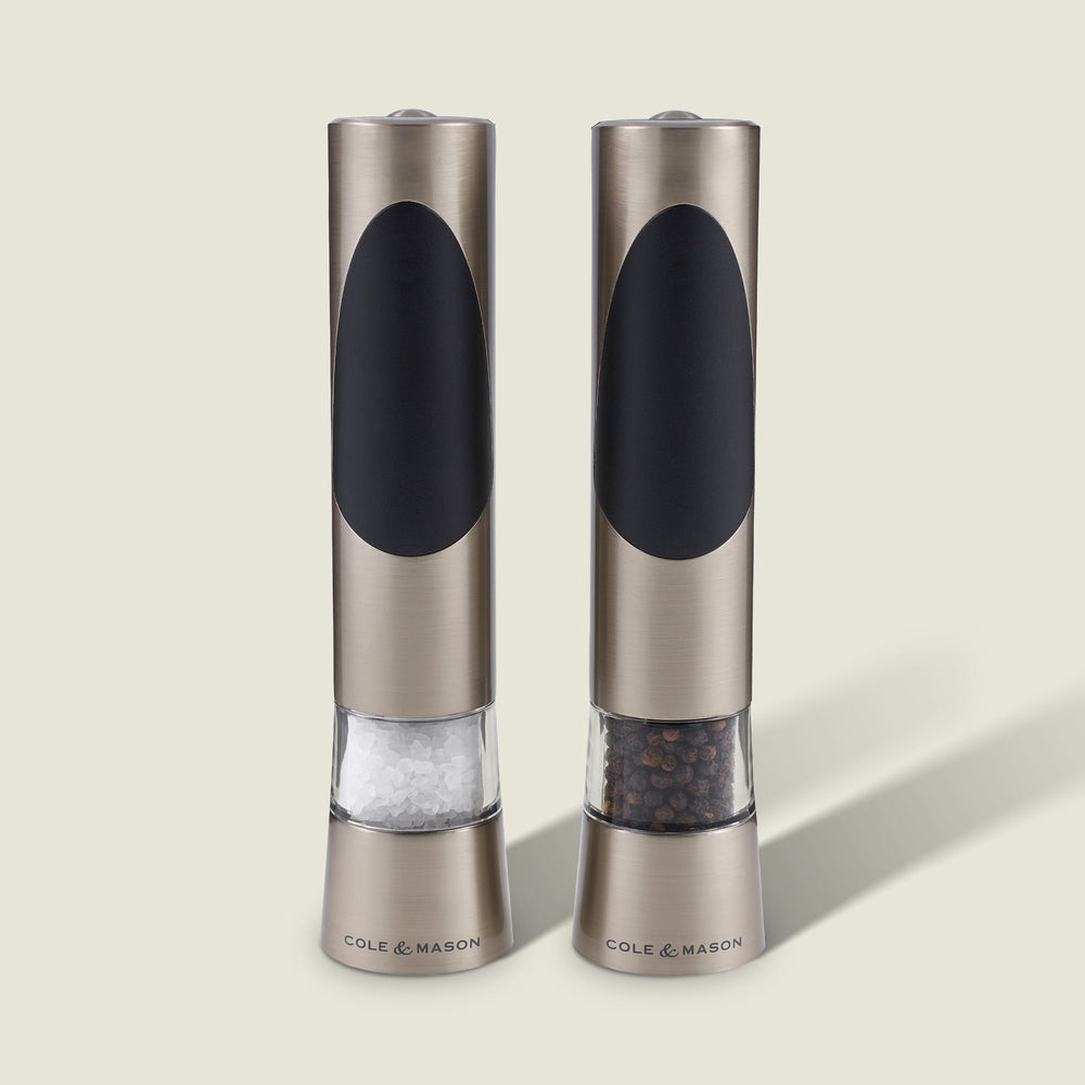 The Cole & Mason Richmond Electronic Salt & Pepper Mill Set features two stainless steel mills with black accents, each for salt or peppercorns, and offers adjustable grind levels for personalized seasoning.