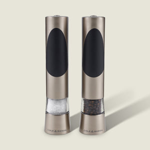 The Cole & Mason Richmond Electronic Salt & Pepper Mill Set features two stainless steel mills with black accents, each for salt or peppercorns, and offers adjustable grind levels for personalized seasoning.