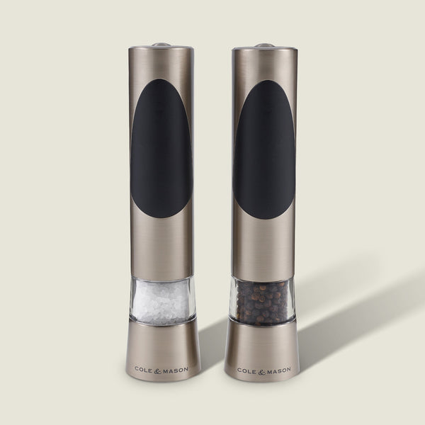 The Cole & Mason Richmond Electronic Salt & Pepper Mill Set features two stainless steel mills with black accents, each for salt or peppercorns, and offers adjustable grind levels for personalized seasoning.